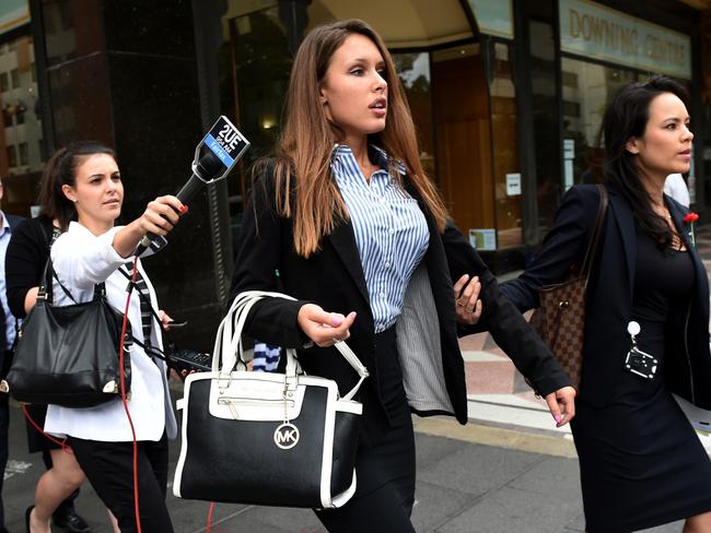 Sophia Tilley (centre) leaving court during one of her appearances was at the centre of the ICAC probe into crown prosecutor Margaret Cunneen at the time. Picture: AAP/Paul Miller