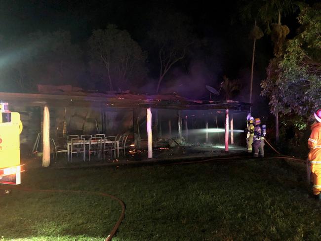 Fireys work to put out a blaze that destroyed a house at Hampden.