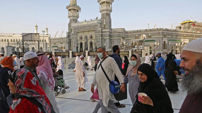 Muslim pilgrims wear masks at the Grand Mosque in Saudi Arabia's holy city of Mecca on February 28. Picture: AFP