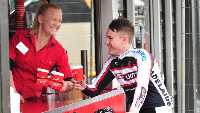 File photo of SA cyclist Rhyse Carpenter getting his coffee from Cibo on Rundle Street, which has now closed.