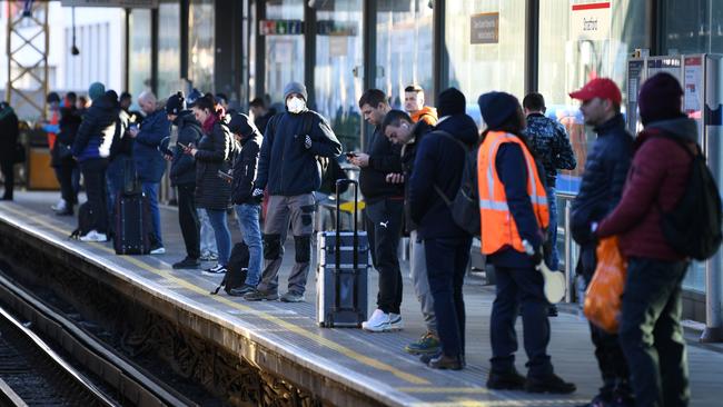 Passengers wait on the platform for a Central Line underground train at Stratford station yesterday. Picture: AFP