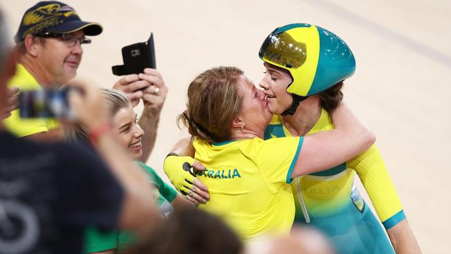 Amy Cure celebrates with family after winning the women's scratch race final during cycling on day four of the Gold Coast 2018 Commonwealth Games at Anna Meares Velodrome. Picture: MATT KING/GETTY IMAGES