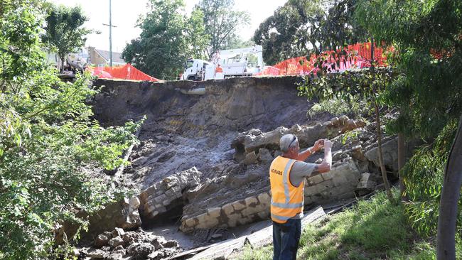 The landslide below the road.