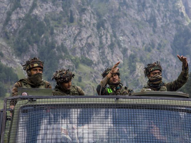 GAGANGIR, KASHMIR, INDIA - SEPTEMBER 2: Indian army convoy carrying reinforcement and supplies, drive towards Leh, on a highway bordering China, on September 2, 2020 in Gagangir, India. India and China, have stumbled once again into a bloody clash over their shared border. India rushed additional troops to Ladakh after claiming to have foiled what it called China's provocative maneuvers to change the status of Line of Actual Control, the de-facto border between the two countries, in the Himalayan region. As many as 20 Indian soldiers were killed in a "violent face-off" with Chinese troops in June this year in the Galwan Valley along the Himalayas. Chinese and Indian troops attacked each other with batons and rocks. The deadliest clash since the 1962 India-China war and both have not exchanged gunfire at the border since 1967. Since the recent clash, there has been no sign of a breakthrough. India said its soldiers were killed by Chinese troops when top commanders had agreed to defuse tensions on the Line of Actual Control, the disputed border between the two nuclear-armed neighbours. China rejected the allegations, blaming Indian soldiers for provoking the conflict, which took place at the freezing height of 14,000 feet. The killing of soldiers has led to a call for boycott of Chinese goods in India. (Photo by Yawar Nazir/Getty Images)