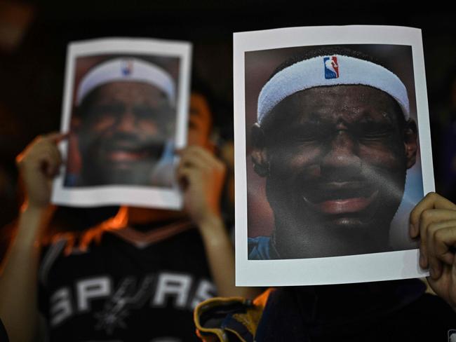 Protesters hold photographs of US NBA star LeBron James at a demonstration in Hong Kong. Picture: Anthony Wallace