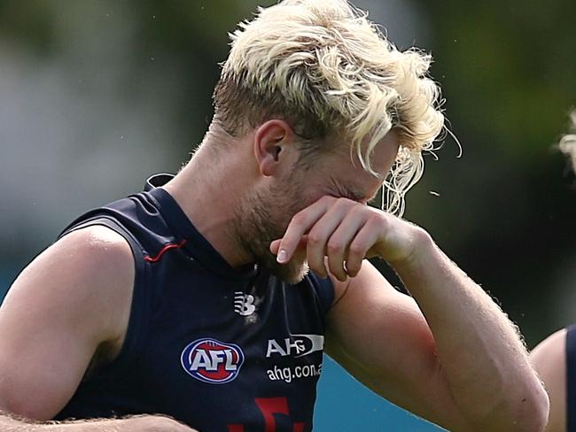 Melbourne training 5/1/2017 Gosch's Paddock. Jack Watts gets hit in the jaw by Ben Kennedy (behind ) & Colin Garland in a tackling drill Picture:Wayne Ludbey