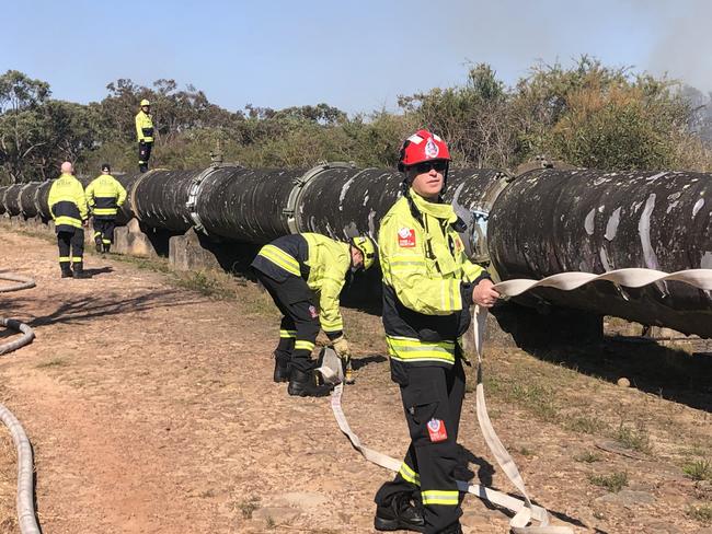 Firefighters battle the blazes on Monday. Picture: Jim O’Rourke