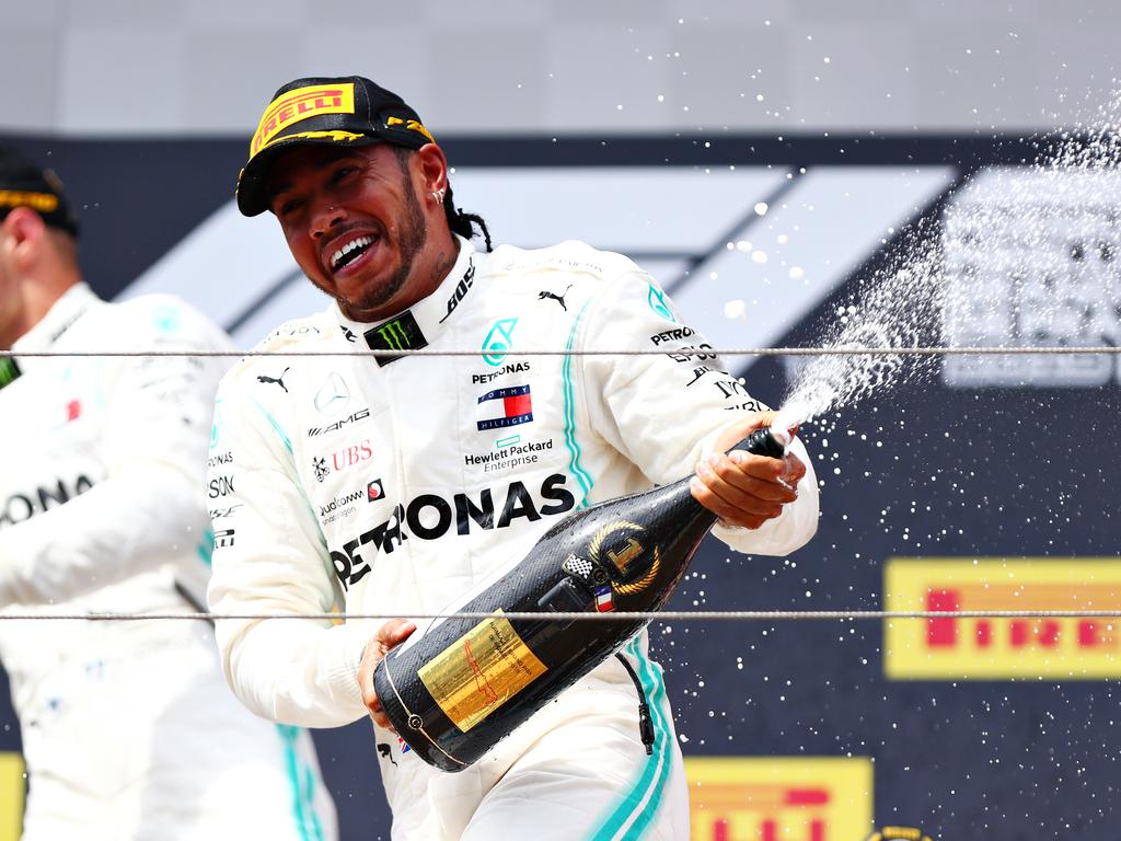 Lewis Hamilton never gets sick of spraying champagne.