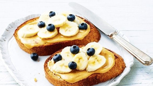 Sourdough toast with nut butter, banana and blueberries.