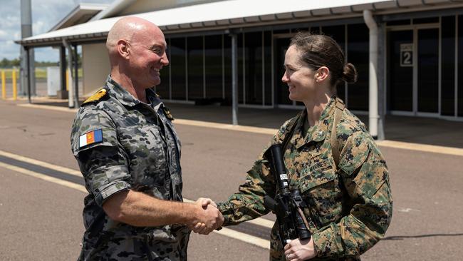 Commander Headquarters Northern Command, Captain Mitchell Livingstone, CSC, RAN, greets Marine Rotational Force Darwin Executive Officer, Lieutenant Colonel Lisa Cordonnier after arriving at RAAF Base Darwin as part of the arrival of the 12th rotation of the Marine Rotational Force Darwin.