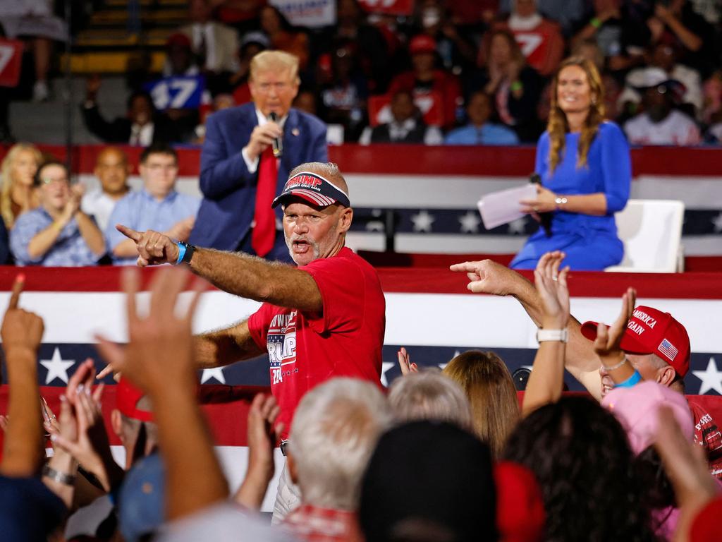 Auto Workers for Trump founder Brian Pannebecker (C) is recognised by former US President and Republican presidential candidate Donald Trump. Picture: AFP