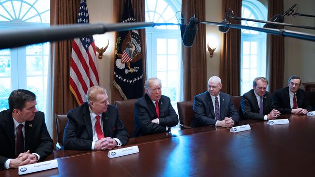 Steel and aluminium industry leaders listen to Donald Trump in the White House Cabinet Room. Pic: AFP