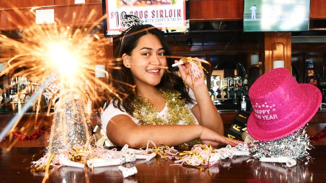 Hotel Darwin bartender Grace Kairua is getting ready for a bumper New Year's Eve, as Territory businesses brace for a big night. Picture: Katrina Bridgeford