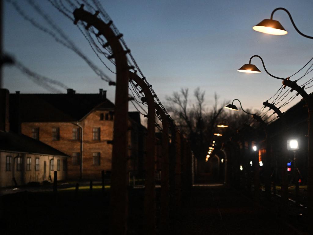 A barbed-wire fence and lights are seen at the site of former German Nazi concentration and extermination camp Auschwitz in Oswiecim, Poland, following commemorations on the 80th anniversary of the camp's liberation by the Red Army on January 27, 1945, just months before the end of the Second World War. Picture: Victoria Jones/Pool/AFP