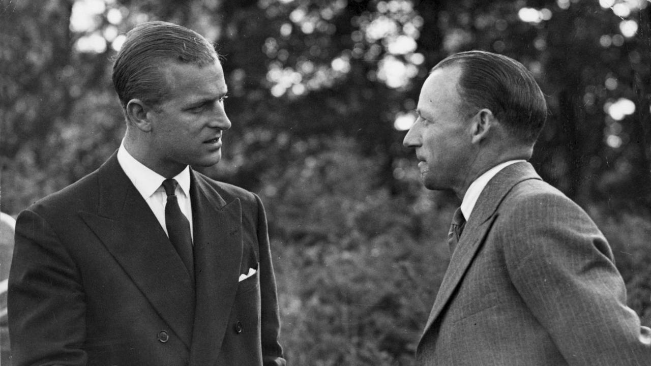 Prince Philip, Duke of Edinburgh speaks with cricketer Sir Donald (Don) Bradman at Balmoral Castle, 1948. Picture: Supplied