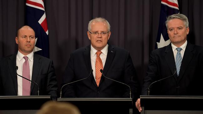 Treasurer Josh Frydenberg (left), Prime Minister Scott Morrison (centre) and departing senator Mathias Cormann. Picture: Getty Images