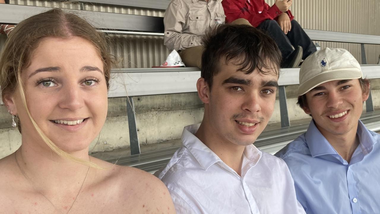 Chloe Edwards, Sam Hindes, and Jeff Haslam enjoy a day of fun at the Gympie Races on Saturday, July 15, 2023.