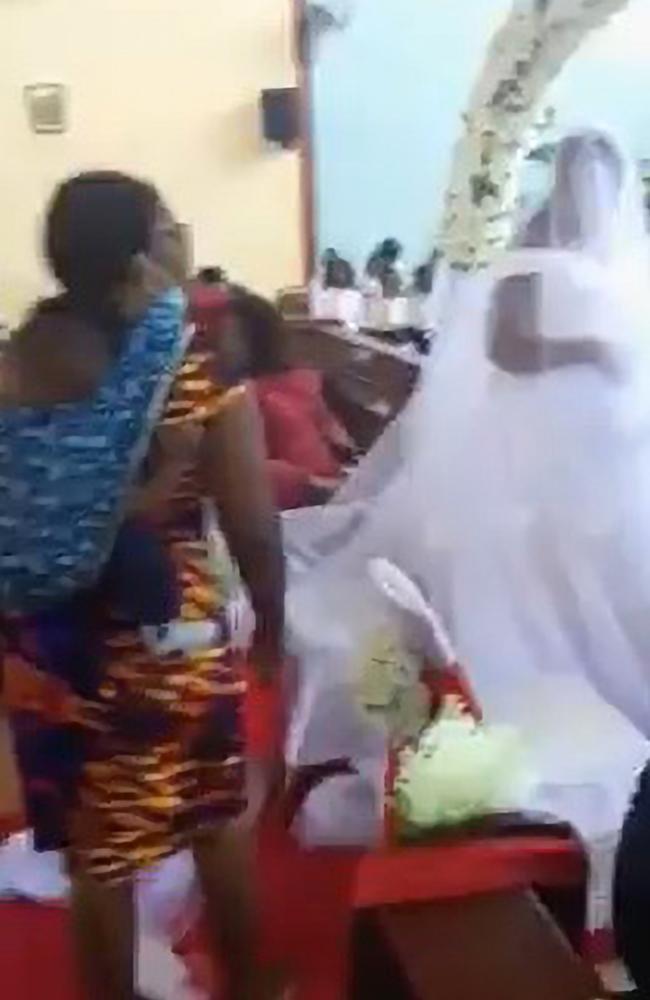 Moment a wife storms into husband’s wedding ceremony to another woman. Picture: Newsflash/australscope