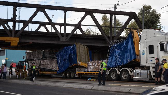 A truck stuck under the bridge at Racecourse Rd.