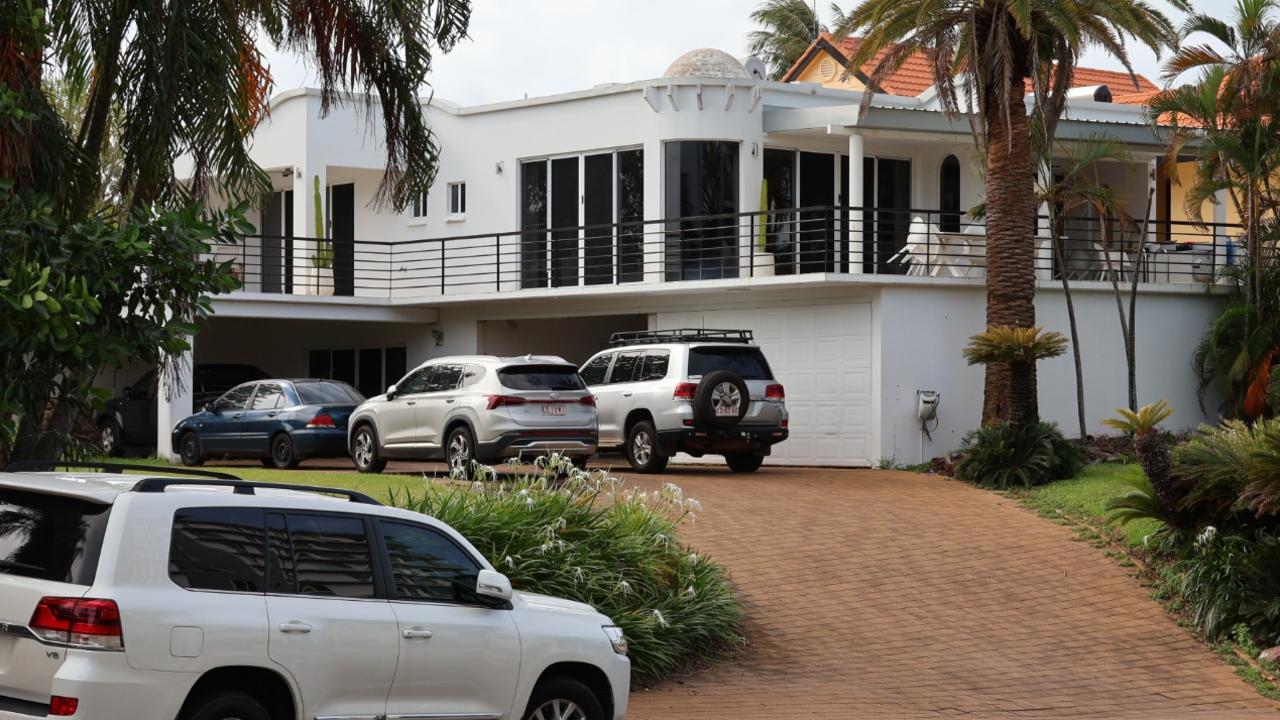 Heavily-armed police officers swarmed on a Cullen Bay Crescent home where they arrested a 53-year-old man over alleged serious harm offences. Picture: Riley Walter