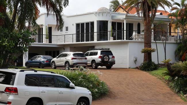 Heavily-armed police officers swarmed on a Cullen Bay Crescent home where they arrested a 53-year-old man over alleged serious harm offences. Picture: Riley Walter