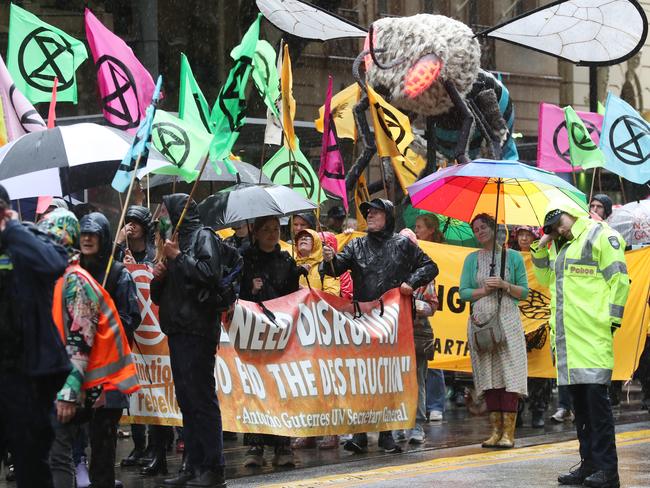 MELBOURNE, AUSTRALIA - NewsWire Photos, DECEMBER 9, 2023. Extinction Rebellion protesters march through Melbourne CBD.  Picture: NCA NewsWire / David Crosling