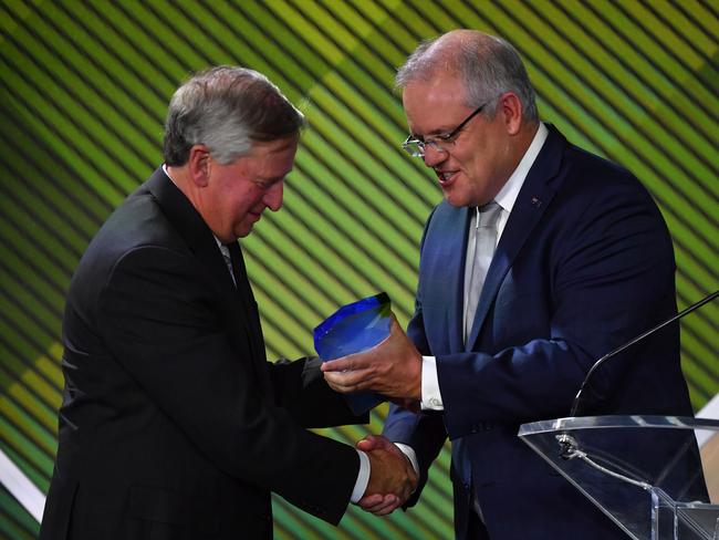 Prime Minister Scott Morrison with 2020 Senior Australian of the Year winner Professor John Newnham. Picture: AAP Image/Mick Tsikas