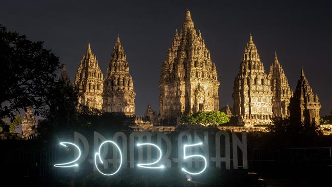 People create a 2025 sign as they wait for the New Year fireworks at the Prambanan Temple, a 9th-century Hindu temple complex and UNESCO World Heritage Site, in Yogyakarta. Picture: AFP