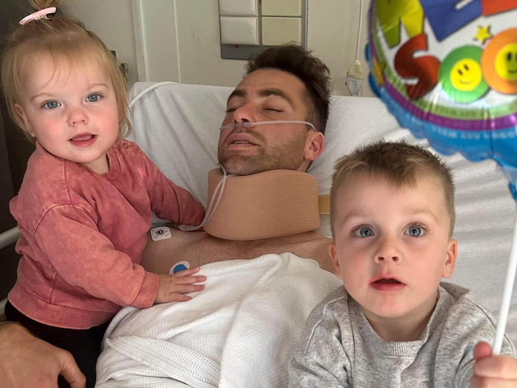 Corio footballer Joel Bennett with his two children at the Albert Hospital. Picture: Joel Bennett Facebook.
