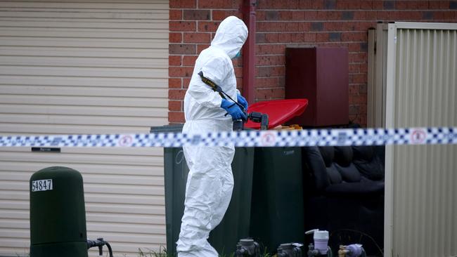 Forensic officers at the scene of the death. Picture: Jonathan Ng