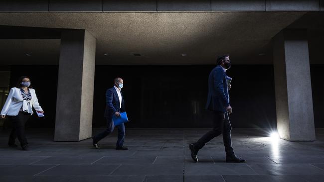 Victorian Premier Daniel Andrews (right) arrives to deliver his daily coronavirus briefing yesterday with Victorian Deputy Premier and Minister for Education James Merlino (centre) and Victorian Minister for Health Jenny Mikakos. Picture: Getty Images