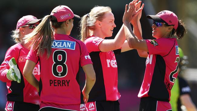 Kim Garth of the Sixers celebrates with team mates after taking the wicket of Alex Blackwell of the Thunder. (Photo by Matt King/Getty Images)