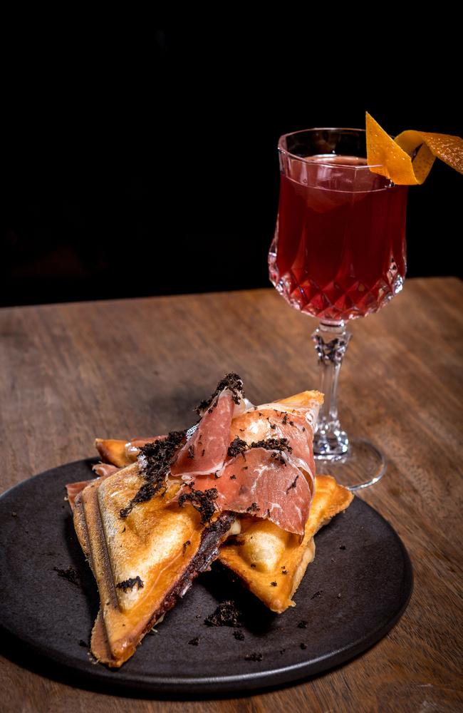 Arlechin has paired its toastie with a hot toddy of bourbon, vino di visciole, panforte spices and honey. Picture: Jake Nowakowski