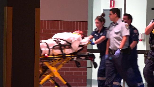 Nicola “Nick” Gilio, stabbed by the alleged attacker, is taken to a waiting ambulance. Picture: TVN