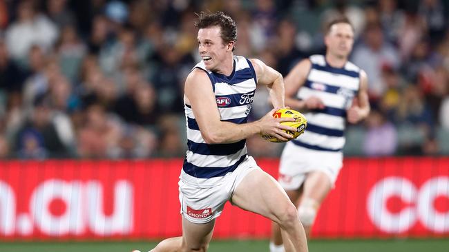 Holmes takes the game on with his blistering run. Picture: Michael Willson/AFL Photos via Getty Images