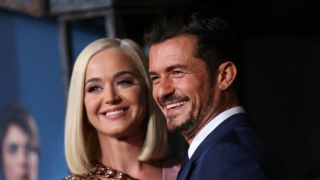 Orlando Bloom, pictured with partner Katie Perry, lives a glossier life than Susie O’Brien. Picture: Getty Images