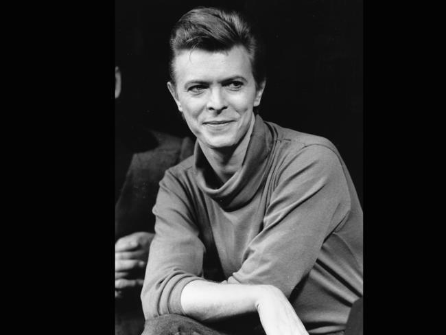 1980 ... David Bowie listens during a news conference after a rehearsal at the Booth Theatre in New York. Bowie was appearing in the Broadway production of <i>The Elephant Man</i>. Picture: AP