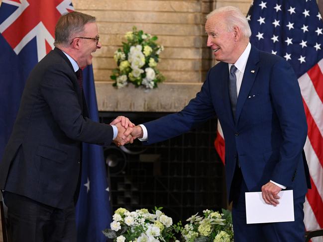 US President Joe Biden shakes hands with Australian Prime Minister Anthony Albanese (L) prior to their meeting during the Quad Leaders Summit at Kantei in Tokyo on May 24, 2022. (Photo by SAUL LOEB / AFP)