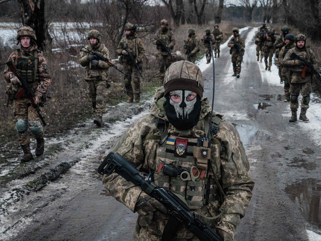 Ukrainian servicemen walk on the road toward their base near the frontline in the Donetsk region amid the Russian invasion of Ukraine. Picture: Yasuyoshi Chiba/AFP