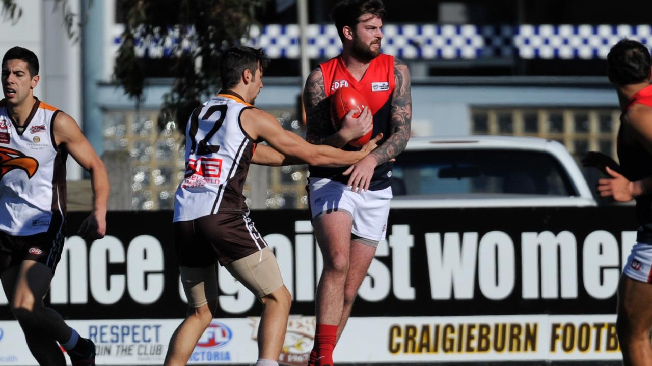 EDFL footy: Tullamarine and Craigieburn lock horns. Picture: Jamie Morey