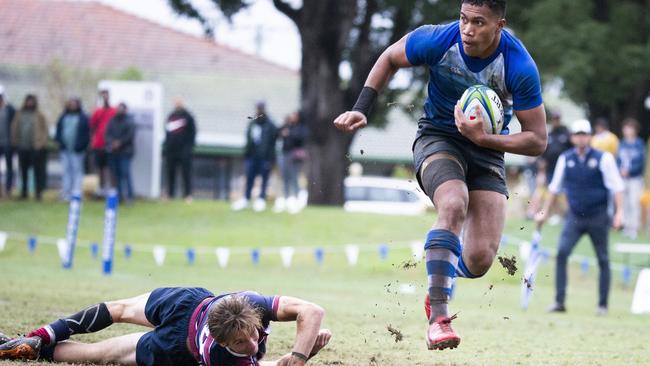 GPS Rugby Nudgee vs The Southport School. Nudgee #11 Sione Tapuosi breaks the tackle from TSS #20. Saturday, July 25, 2020 - Picture: Renae Droop