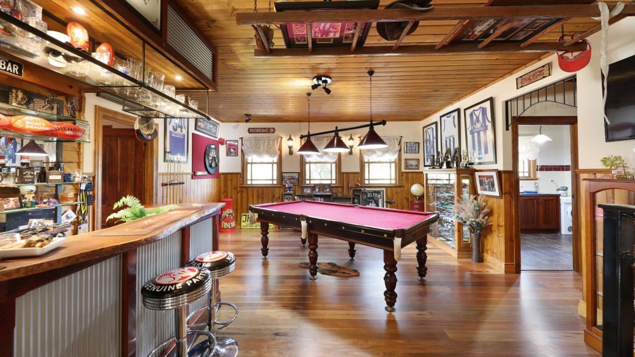 The main living area is home to a bar and billiards’ space – and plenty of North Melbourne meorabillia.