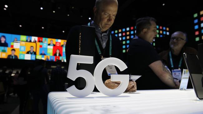 People look at 5G phones at the Samsung booth during the CES tech show, Tuesday, Jan. 7, 2020, in Las Vegas. Picture: AP Photo/John Locher