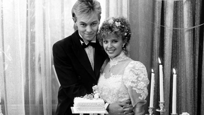 Characters Scott and Charlene (Jason Donovan and Kylie Minogue) on their on-screen wedding day. Picture: Channel 10