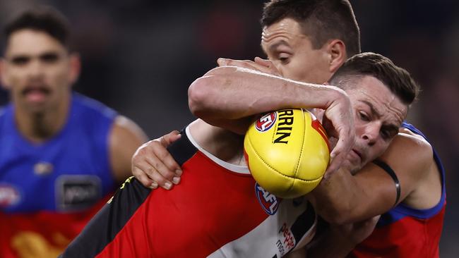 Hugh McCluggage tackles Brad Crouch during the match between the St Kilda Saints and the Brisbane Lions at Marvel Stadium on August 12, 2022 in Melbourne, Australia. (Photo by Darrian Traynor/Getty Images)