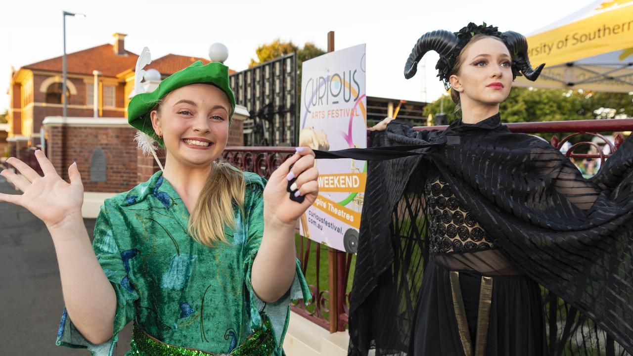 Caitlin Sharpe (left) and Isabel Morris of Dance Central outside the Curious Arts Festival to attract visitors to the Empire Theatres, Saturday, April 2, 2022. Picture: Kevin Farmer