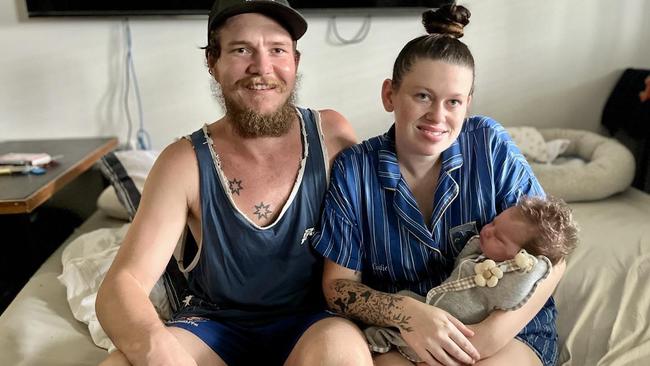 Codie and Jonty Brown and newborn infant daughter Remi were rescued by 'floody legend' Alex Brooker west of Ingham. Picture: Cameron Bates