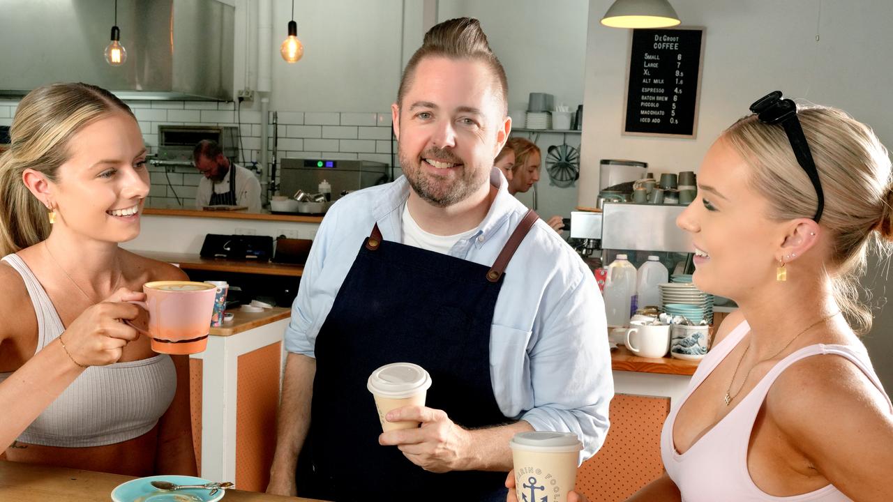 Ben Nash, owner of Seafaring Fools on the Broadway at Glenelg, discussing beans with Sarah Ford (L) and Rachel Thomson (R). Picture: Dean Martin