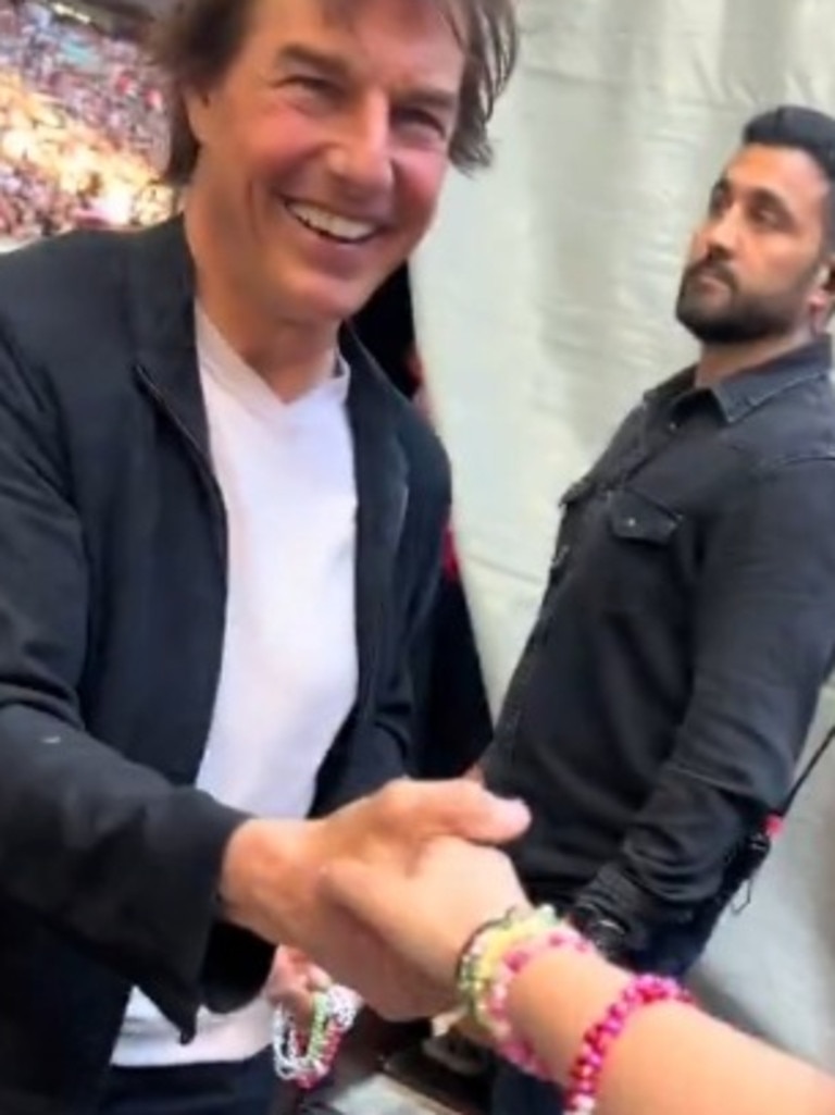 Tom Cruise presses the flesh with Swifties.