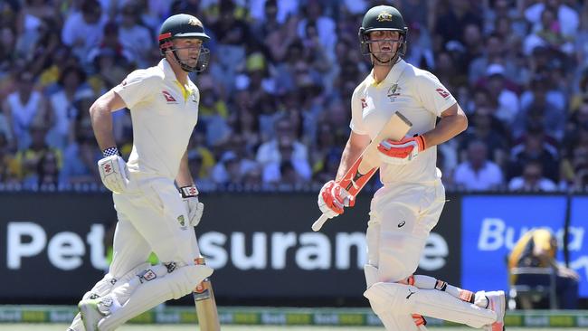 Shaun, left, and Mitchell Marsh run between wickets during the second day of the Boxing Day Test. Picture: AP.